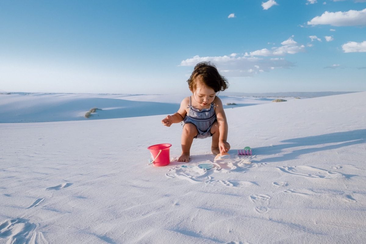 Kalina playing in the sand at White Sands New Mexico.