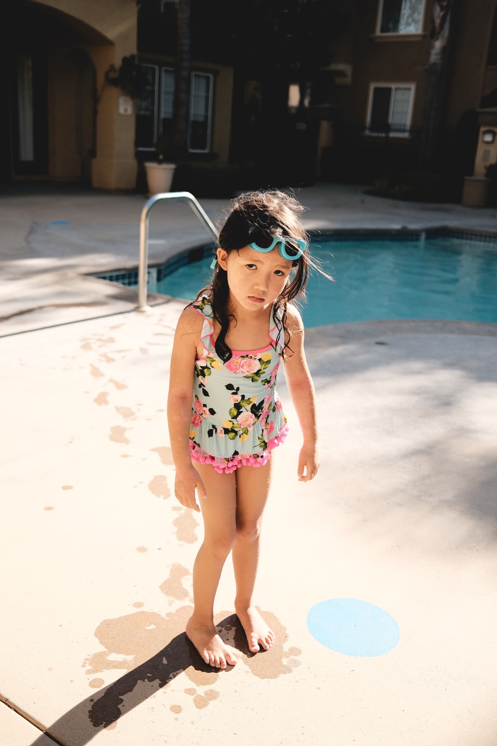 wet and cold little girl at the pool.