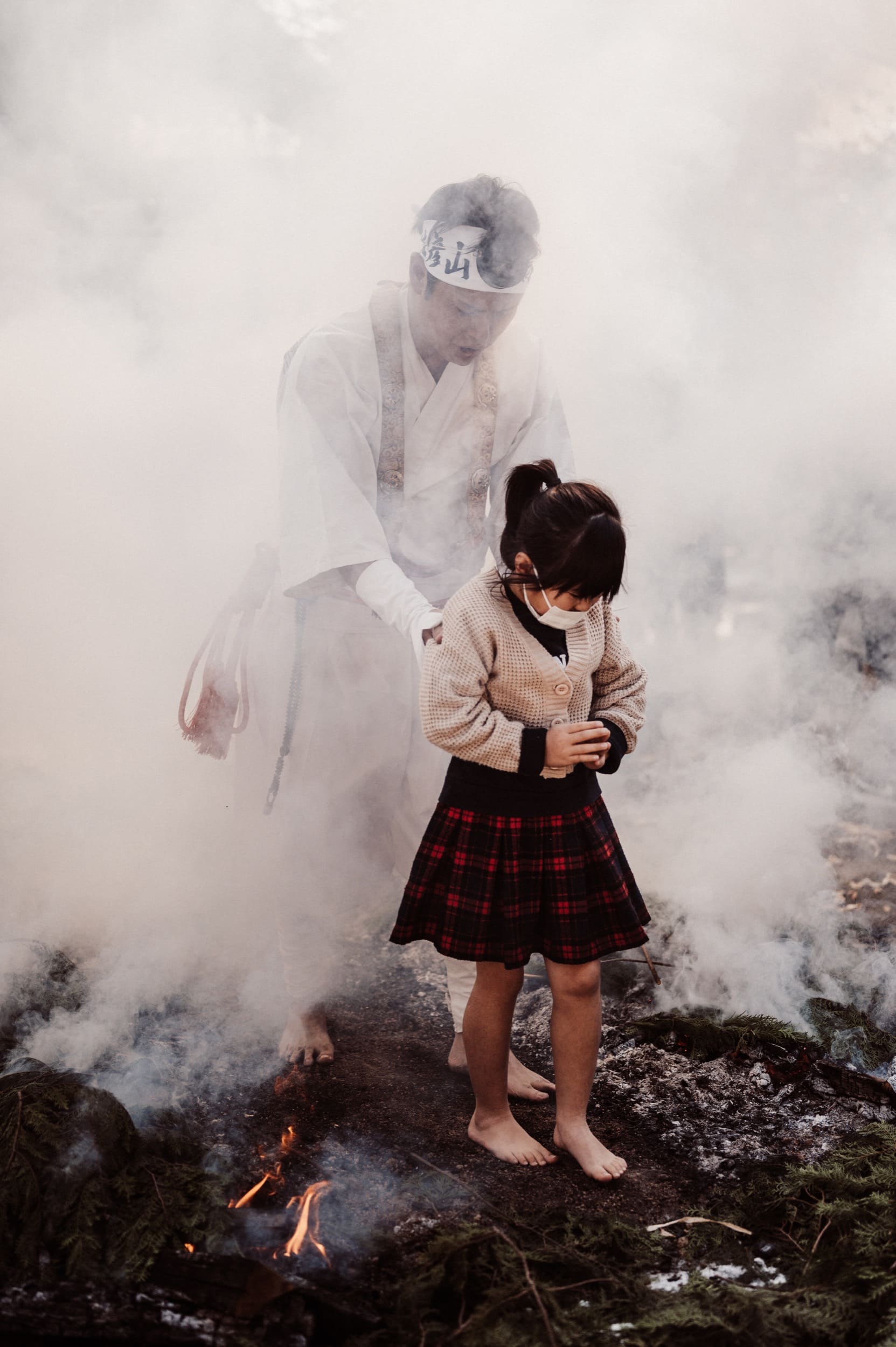 monk escorts little girl through fire