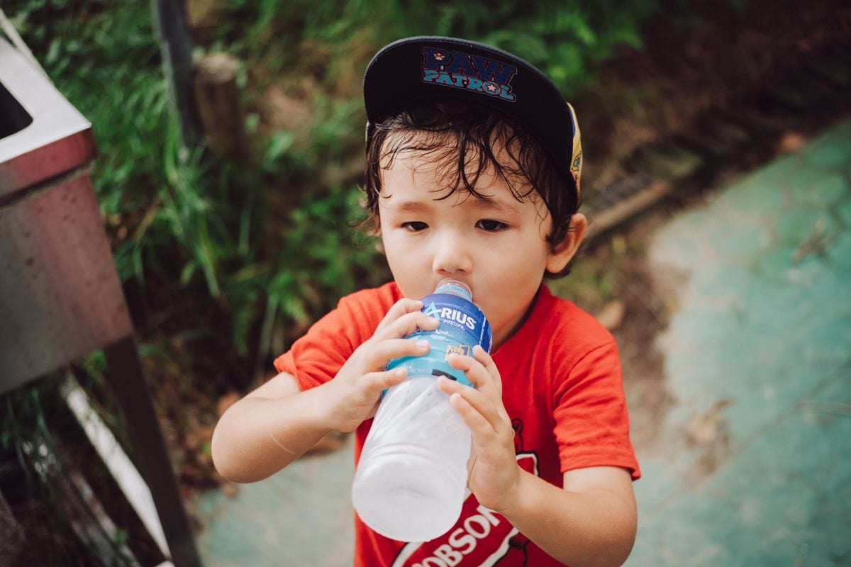 closeup of boy drinking water