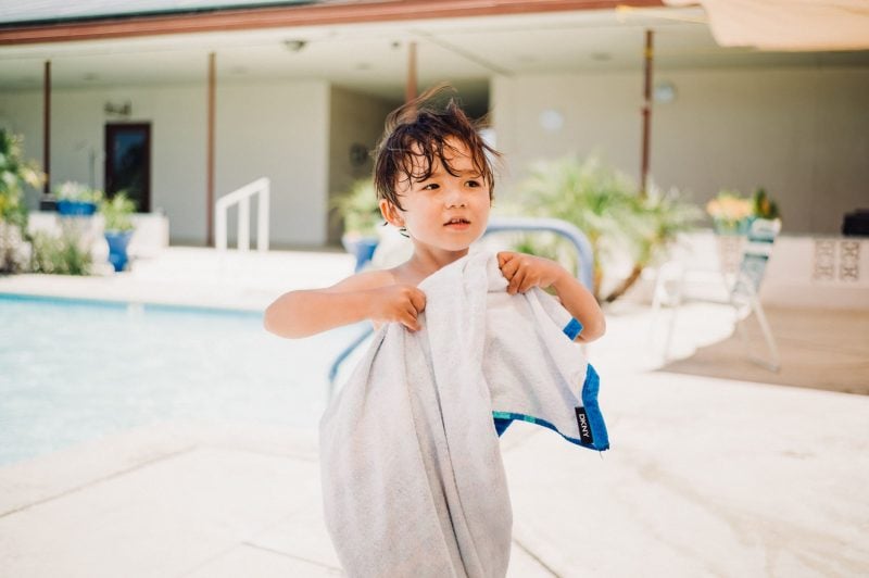 Lifestyle photo of little boy at the pool