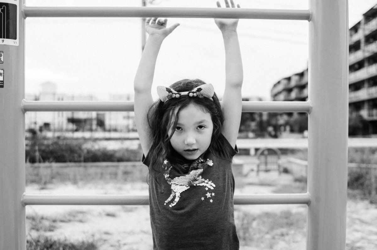 Lifestyle Photo of little girl playing at park