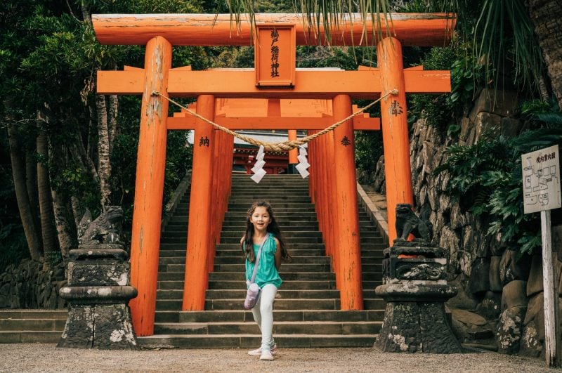 Girl posing in front of a shrine