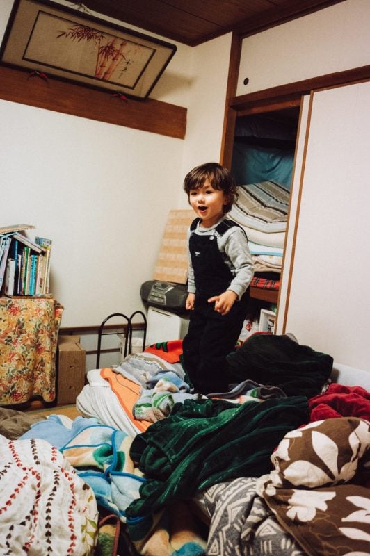 Little boy playing in room.